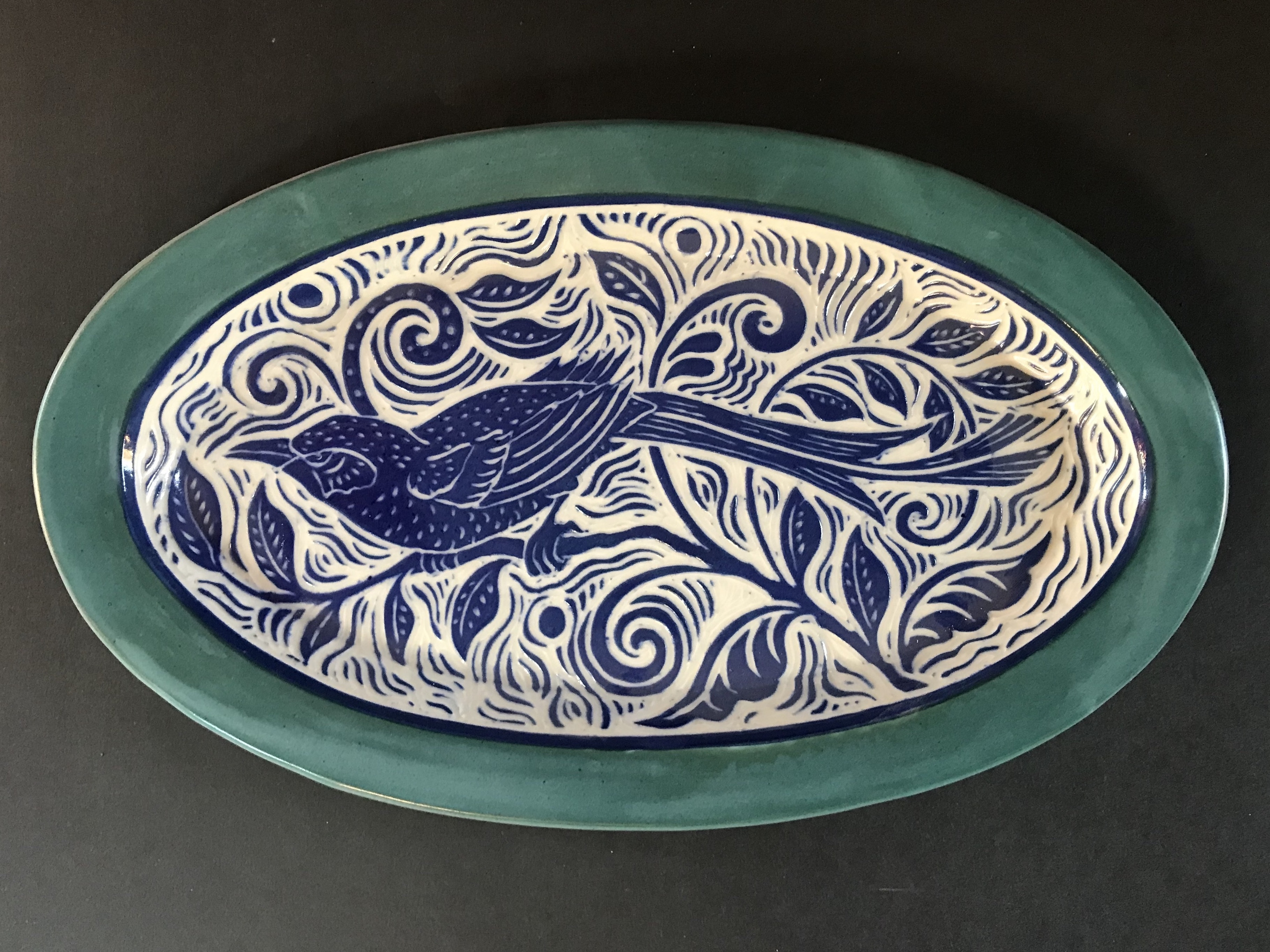 Ceramic Oval Serving Dish in Cobalt Blue, White, and Turquoise with Stylized Magpie Design