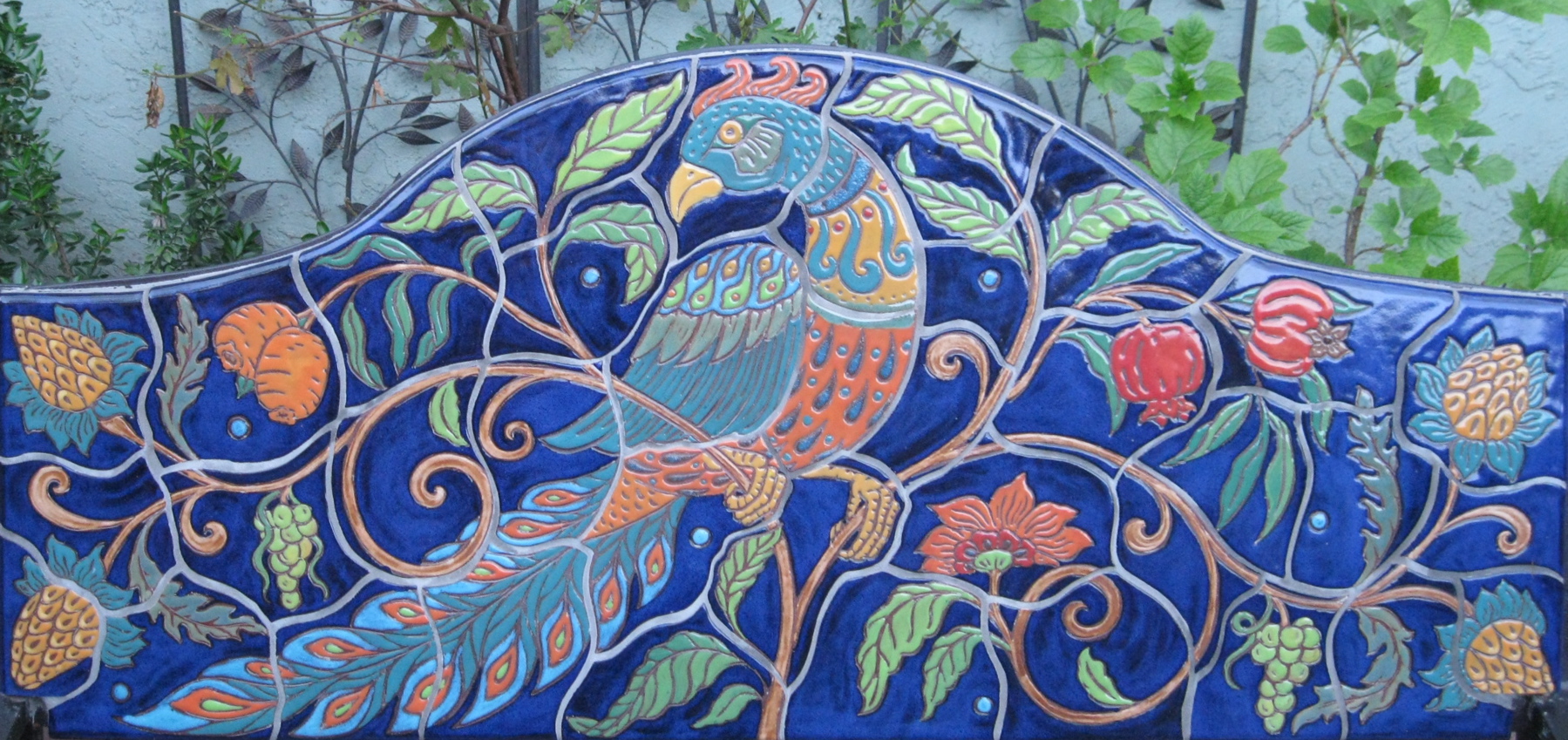 Detail of Colorful Ceramic Bench Back with Bird Design