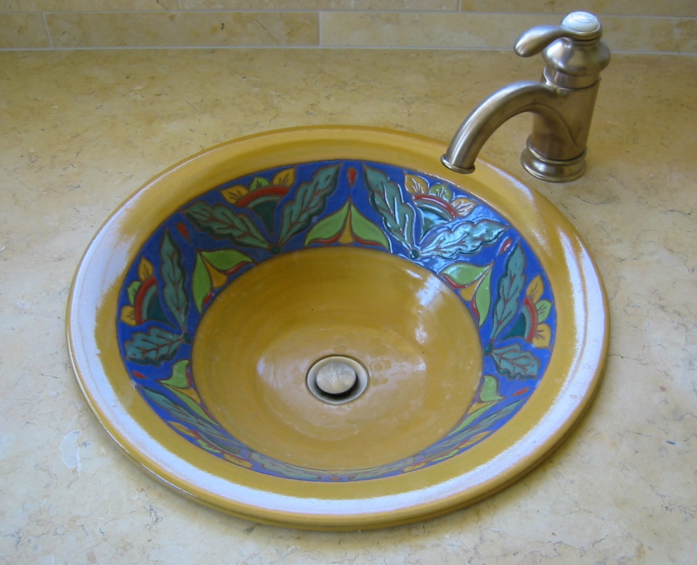 Yellow Sink in Cuerda Seca Style, Set in Travertine Bathroom