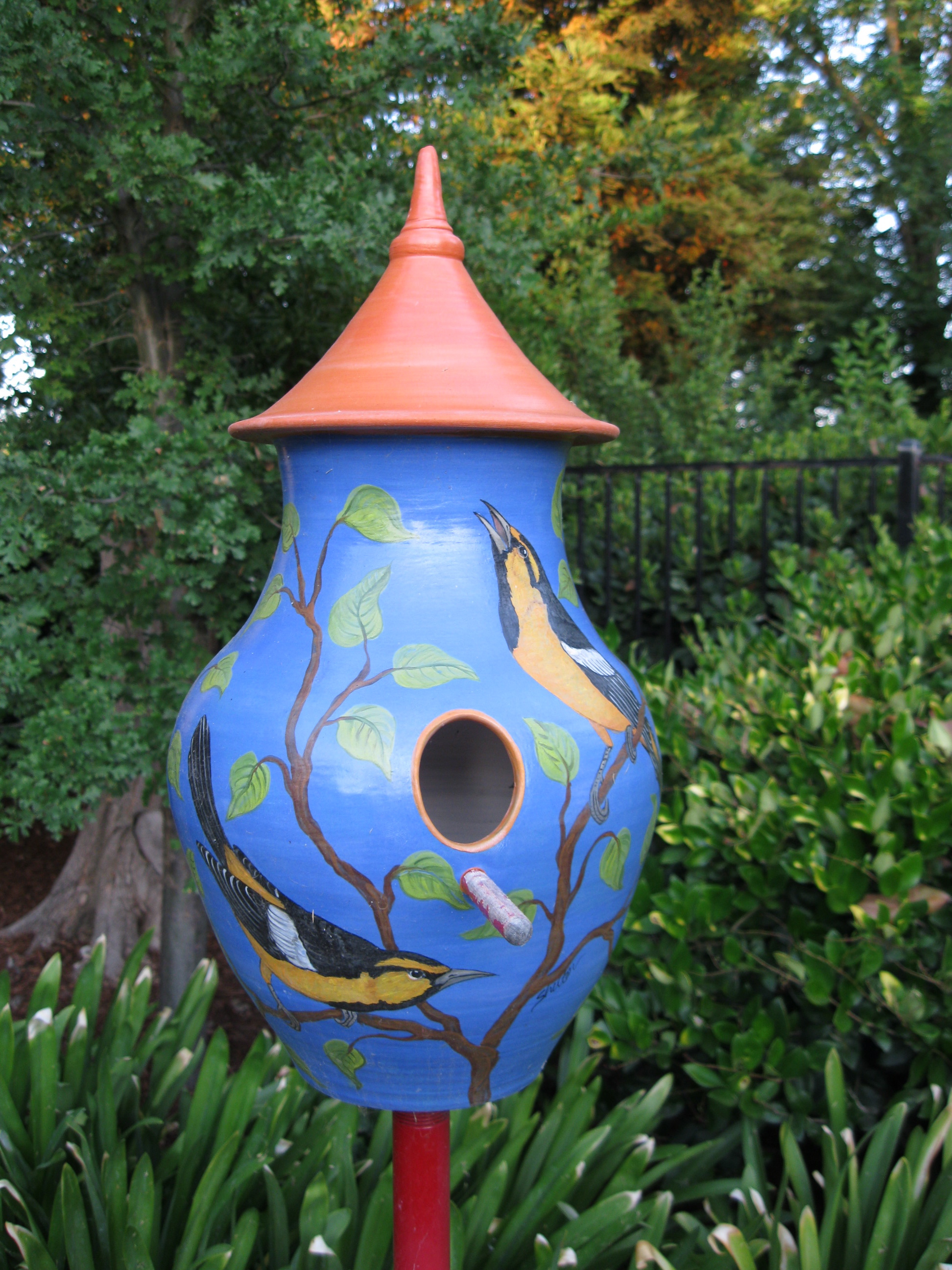 Colorful Ceramic Birdhouse with Oriole design