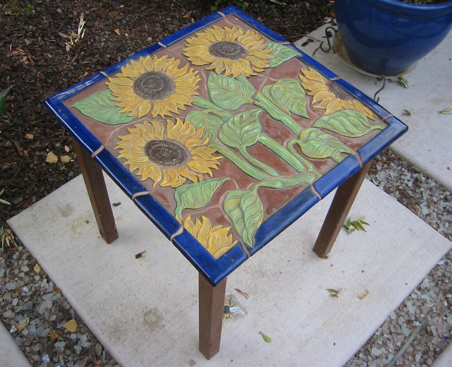 Carved Ceramic Table with Sunflower Design